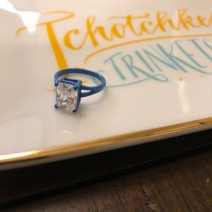 Blue costume ring with white square stone